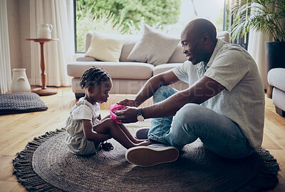 Buy stock photo Shot of a father feeding his daughter at home