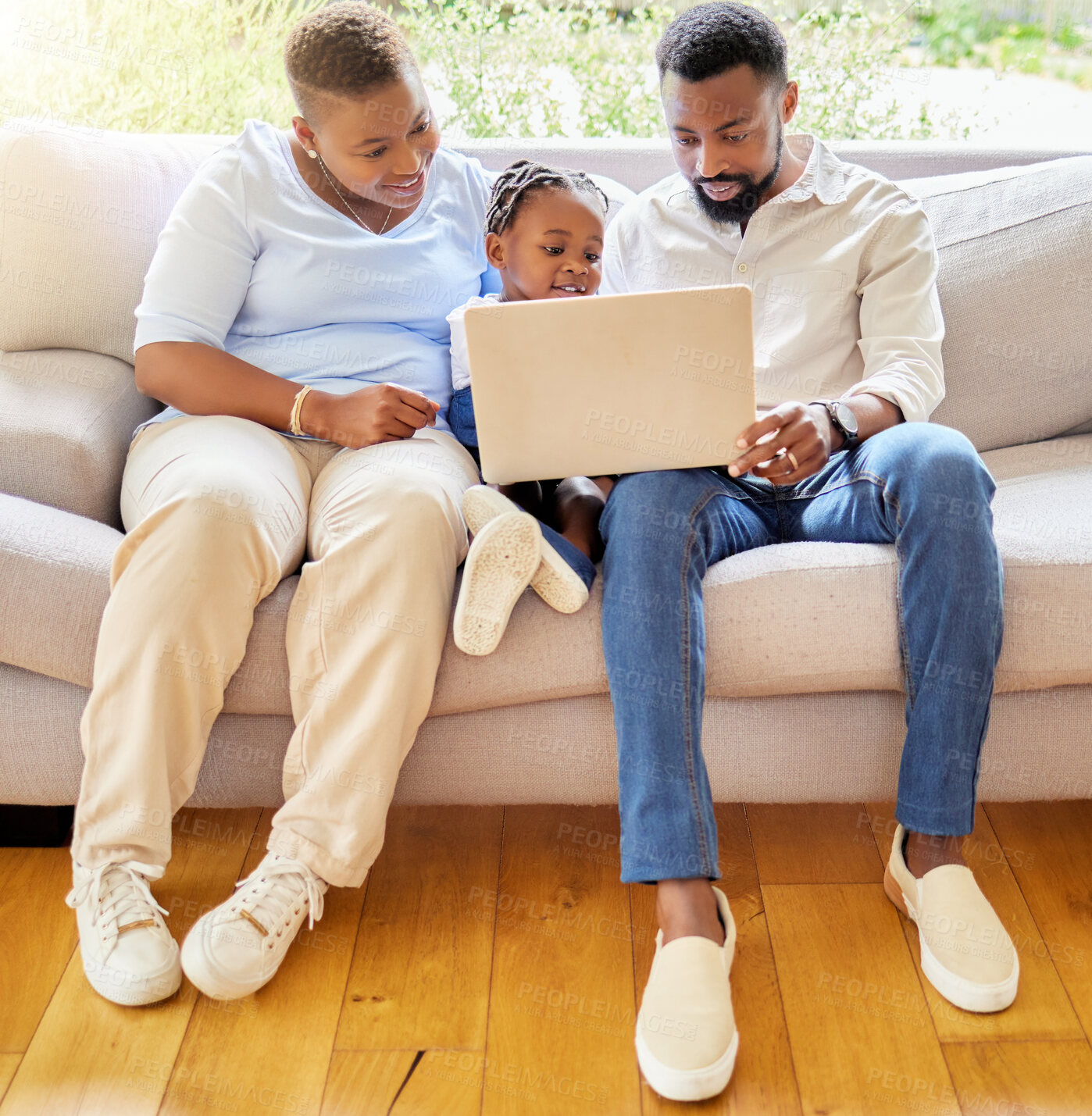 Buy stock photo Parents, child and laptop for education or watching movie together on streaming internet. Black family, kid and film or video on sofa for bonding connection in America, relax or subscription service