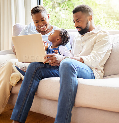 Buy stock photo Shot of a family using a laptop together at home