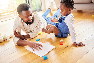 Buy stock photo African dad, girl and floor for drawing, paper and learning together with smile, love and care in lounge. Black man, daughter and teaching with toys, notebook and helping hand in happy family house