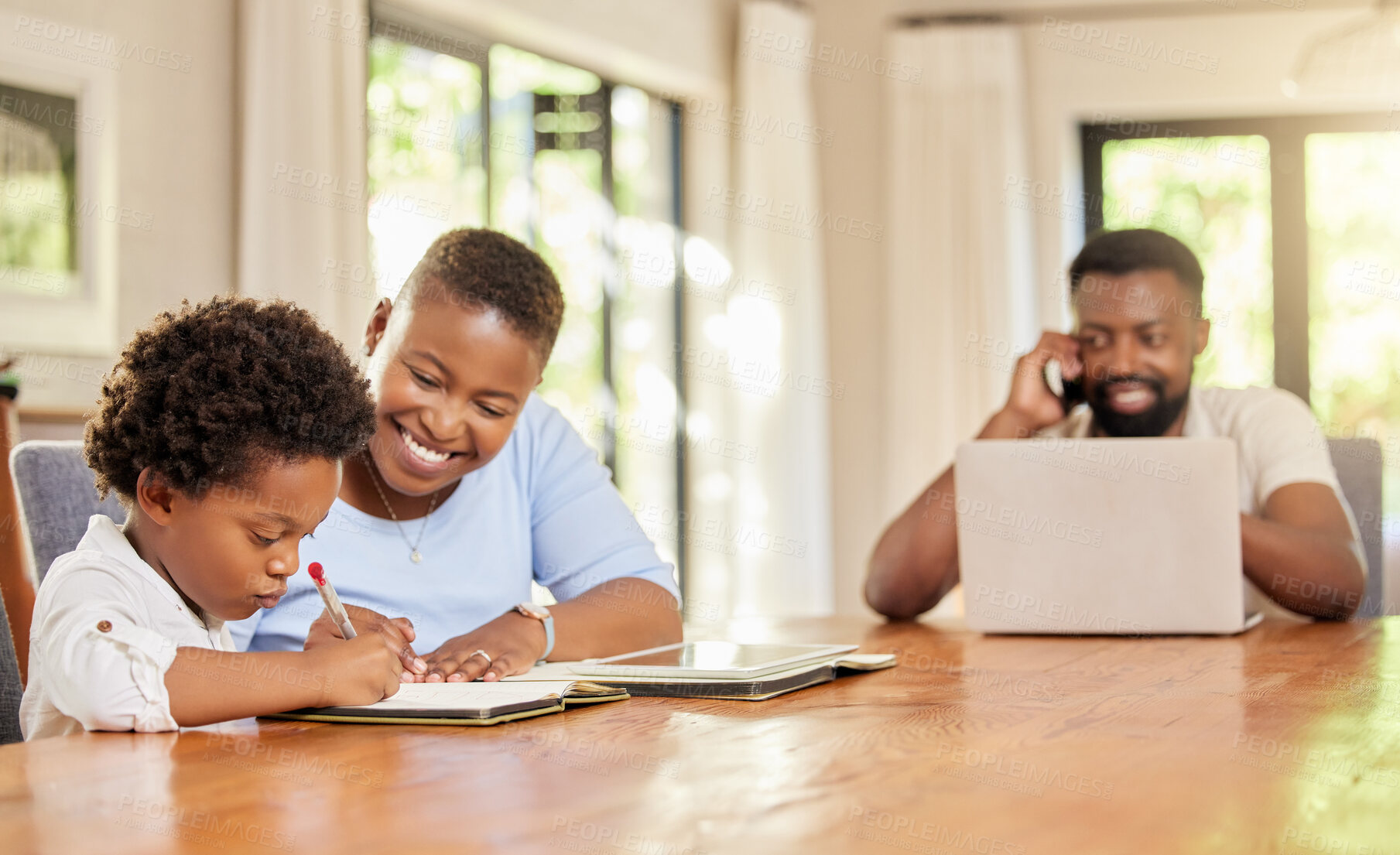 Buy stock photo Shot of a mother helping her son with homework at home