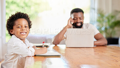 Buy stock photo Shot of a little boy doing homework while his dad uses a laptop at home