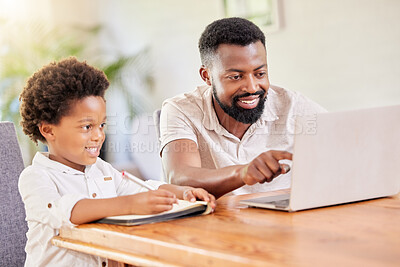 Buy stock photo Shot of a father helping his son with homework at home