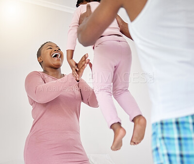 Buy stock photo Shot of a young family having fun together at home