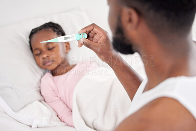 Buy stock photo Shot of a father caring for his sick daughter at home