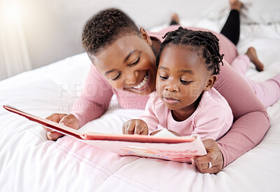 Buy stock photo Book, reading and mother with child in bed for learning, bond and fantasy at home. Storytelling, family and parent with girl in a bedroom with notebook for literature, relax and fun in their house