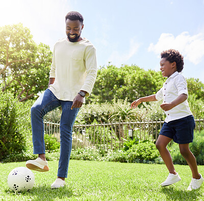 Buy stock photo Soccer, dad and kid on a summer garden with exercise, sport learning and goal kick together. Lawn, fun game and black family with football on grass with youth, sports development and bonding on field