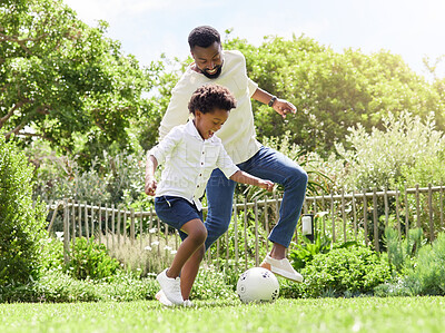 Buy stock photo Soccer, happy dad and kid on a garden with exercise, sport learning and goal kick together. Lawn, fun game and black family with football on grass with youth, sports development and bonding on field