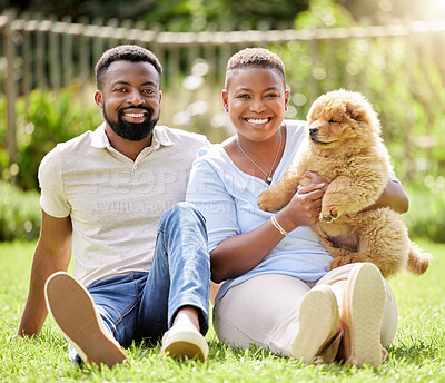 Buy stock photo Portrait of a young couple relaxing with their pet dog outdoors