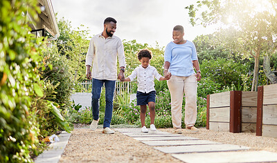 Buy stock photo Shot of a happy family taking a walk together outdoors