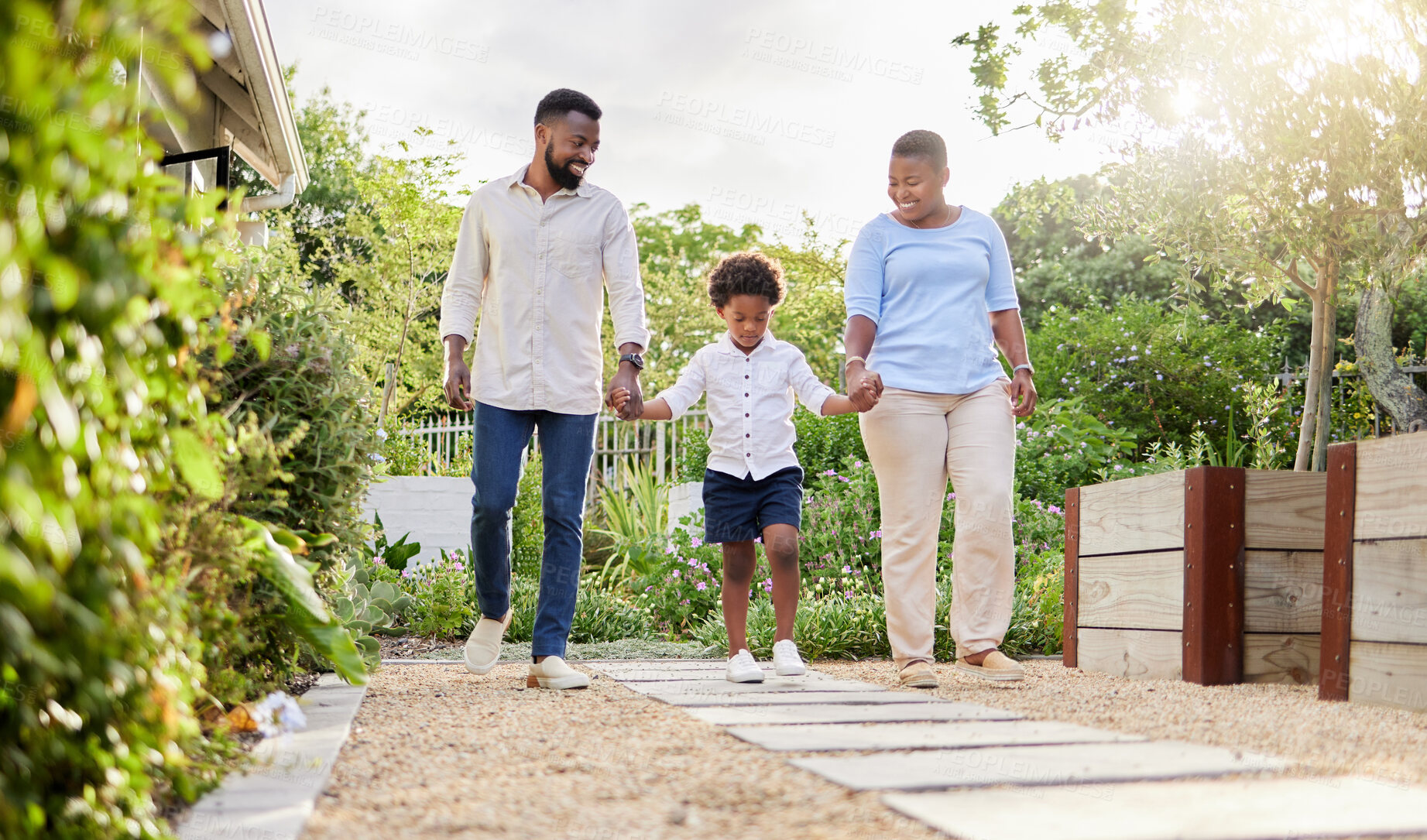 Buy stock photo Black family, holding hands and walking together in nature, bonding and support in countryside. Parents, son and trust on weekend trip for love, peace and trees on journey in outdoor and holiday