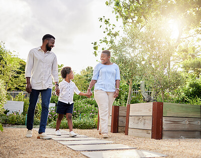 Buy stock photo Shot of a happy family taking a walk together outdoors