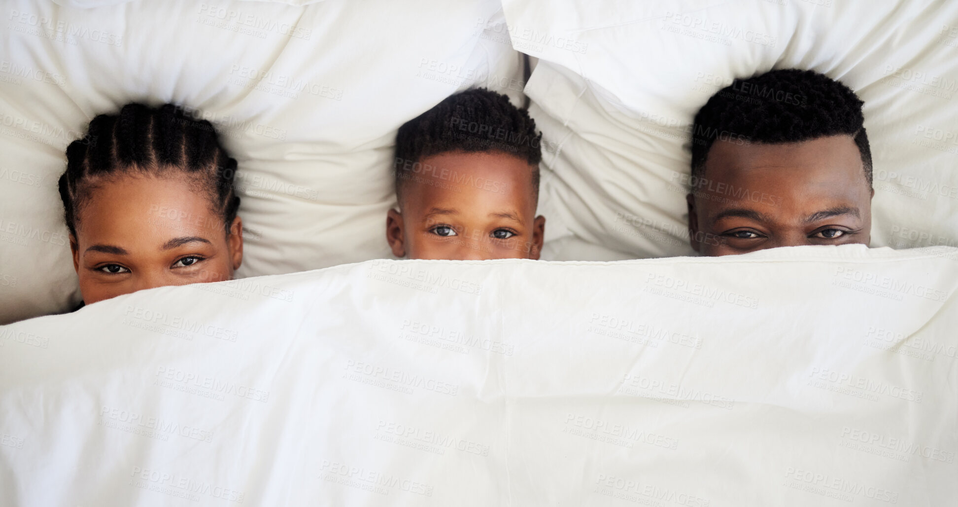 Buy stock photo Parents, child and portrait in bed with cover, eyes and relationship from above. Happy black family, wakeup and together in blanket for development, rest and relax in bedroom with fun at home