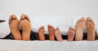 Buy stock photo Love, bed and closeup of family feet relaxing, laying and bonding in the bedroom with a blanket. Zoom of a mother, father and children resting or sleeping barefoot together on weekend in their house.