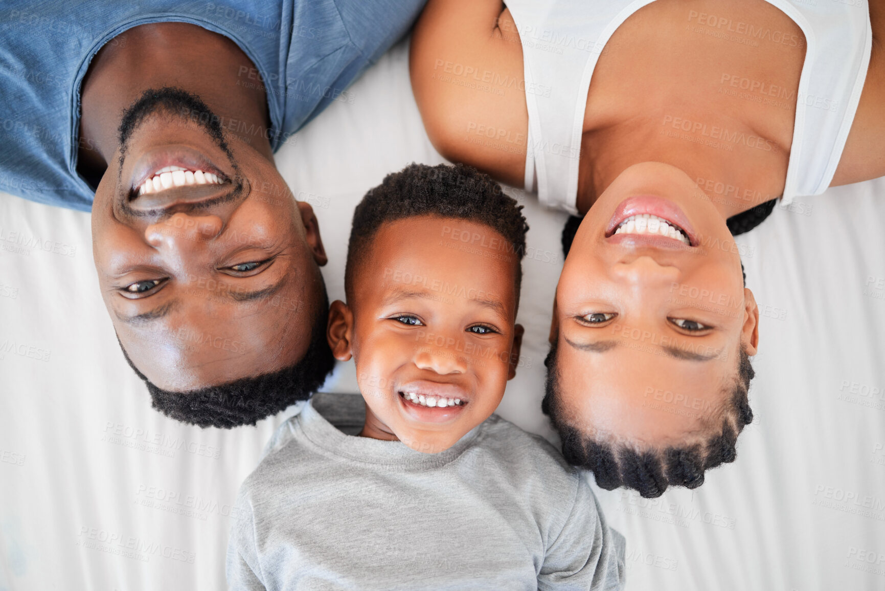 Buy stock photo Top view, bedroom and portrait of parents with love, happiness and bonding or having fun on weekend. People, black family and mother with father and children laying in bed to relax in morning