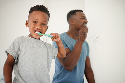 Buy stock photo African father, bathroom and brushing teeth with son, care or love for cleaning, hygiene or dental health. Black man, boy and toothbrush in family house for portrait, smile or clean mouth in morning