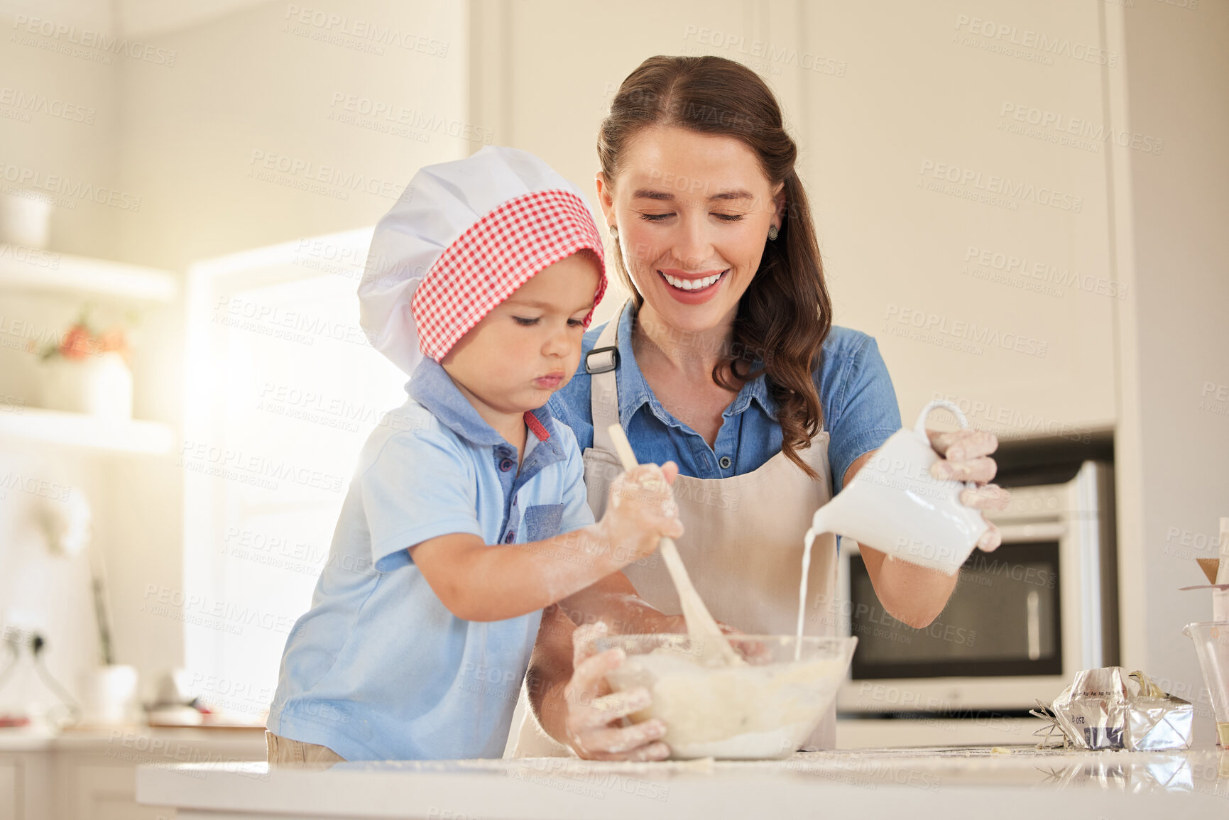 Buy stock photo Mother, baking and teaching with child in kitchen for bonding, growth for development and learning. Boy, helping and cooking for dinner preparation at home, love and care for support or healthy food