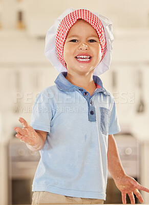 Buy stock photo Shot of a little boy happily covered in flour and dough from baking