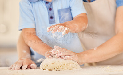 Buy stock photo Shot of a mother and son kneading dough together