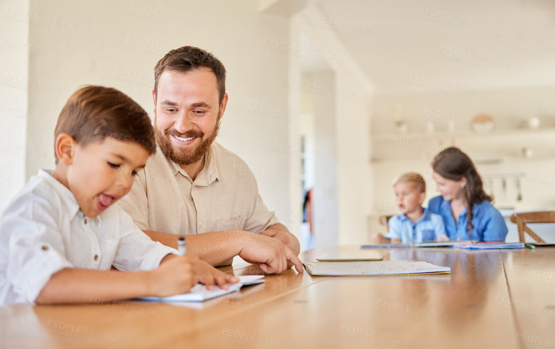 Buy stock photo Shot of a young mother and father helping their sons with his homework using a laptop