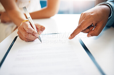 Buy stock photo Cropped shot of two unrecognisable businesspeople signing a contract in the office
