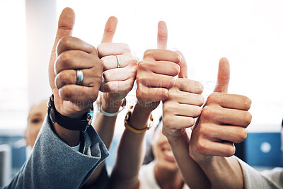 Buy stock photo Cropped shot of an unrecognisable group of businesspeople standing together in the office and showing a thumbs up