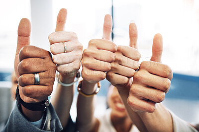 Buy stock photo Cropped shot of an unrecognisable group of businesspeople standing together in the office and showing a thumbs up