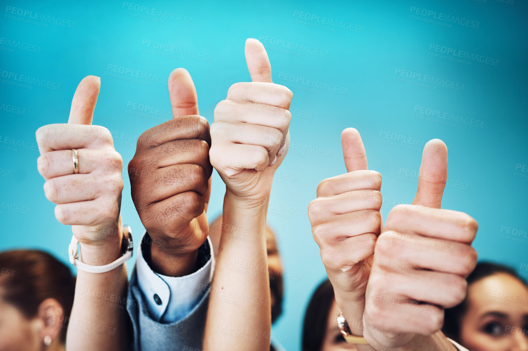 Buy stock photo Cropped shot of an unrecognisable group of businesspeople standing together in the office and showing a thumbs up