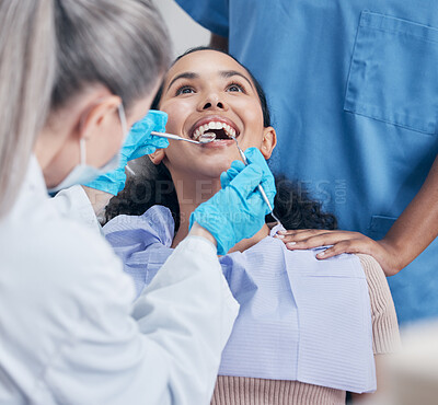 Buy stock photo Shot of a young woman having a dental checkup