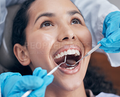 Buy stock photo Shot of a dentist checking a young patients progress