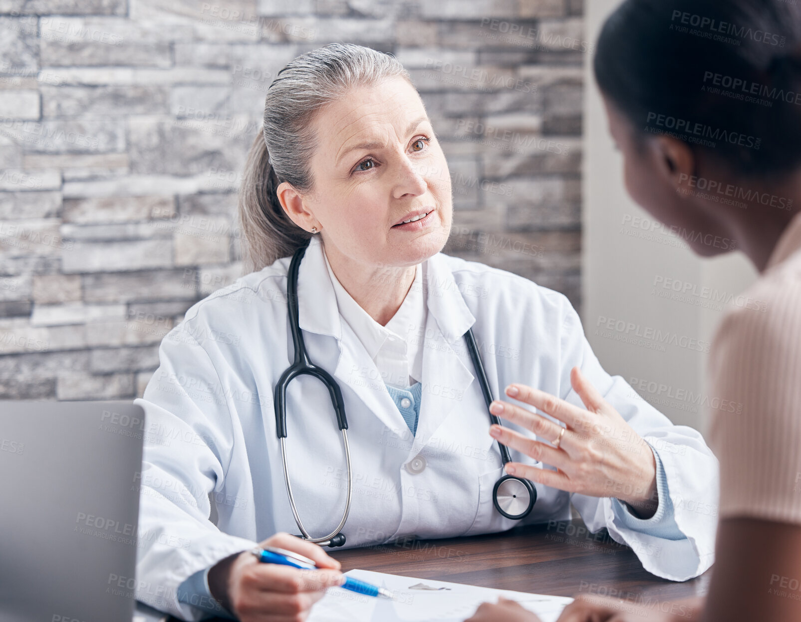 Buy stock photo Advice, people and doctor in consultation with writing prescription for diagnosis in hospital or clinic. Mature woman, healthcare worker and patient with symptoms in office for support or wellness