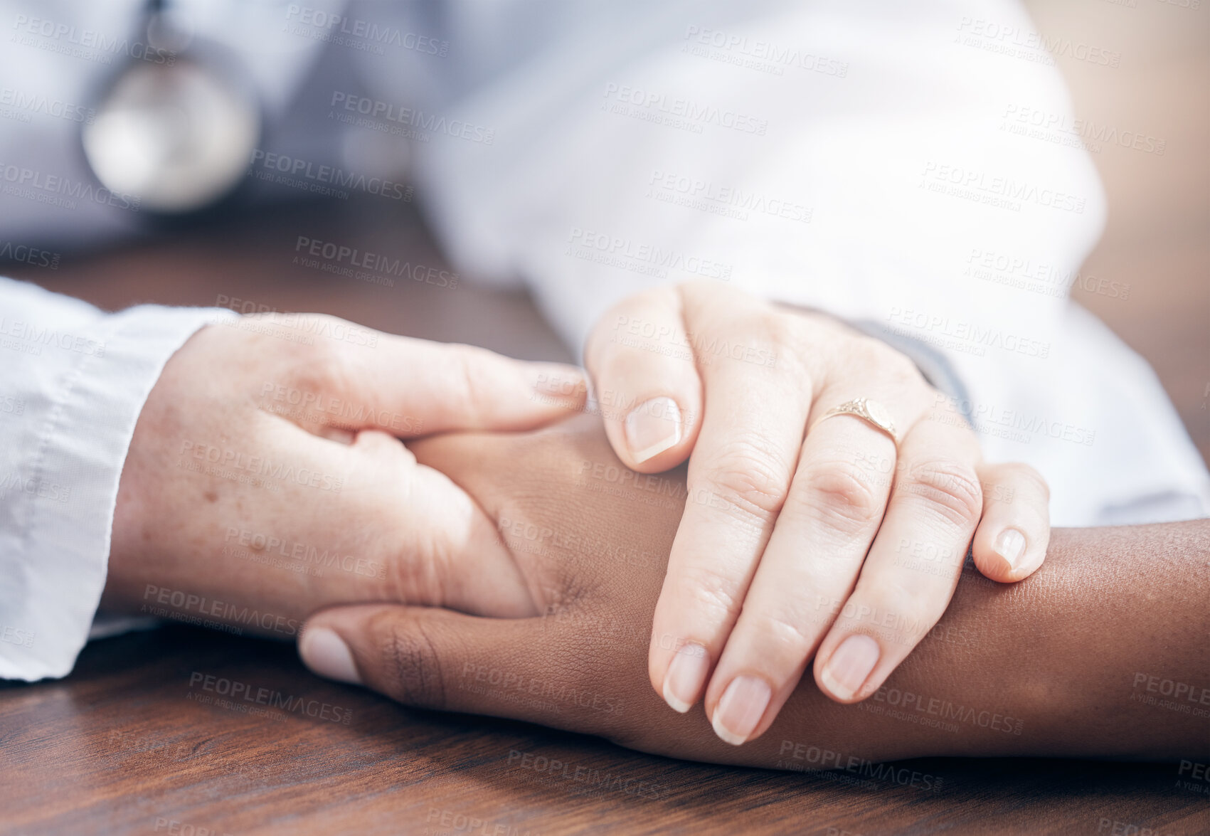 Buy stock photo Doctor, patient and hands for empathy on desk at office, support or trust at hospital. Palms, care and health with man and woman in clinic, together for kindness or helping others with cancer or pain