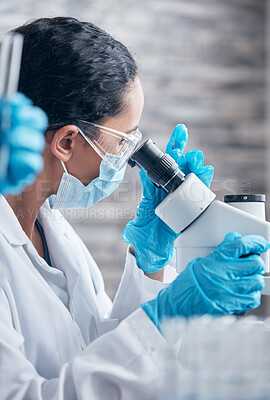 Buy stock photo Science, woman scientist using a microscope and in a laboratory with health scrubs. Biotechnology specialist or biology, chemistry or technician and female doctor or surgeon for medical research