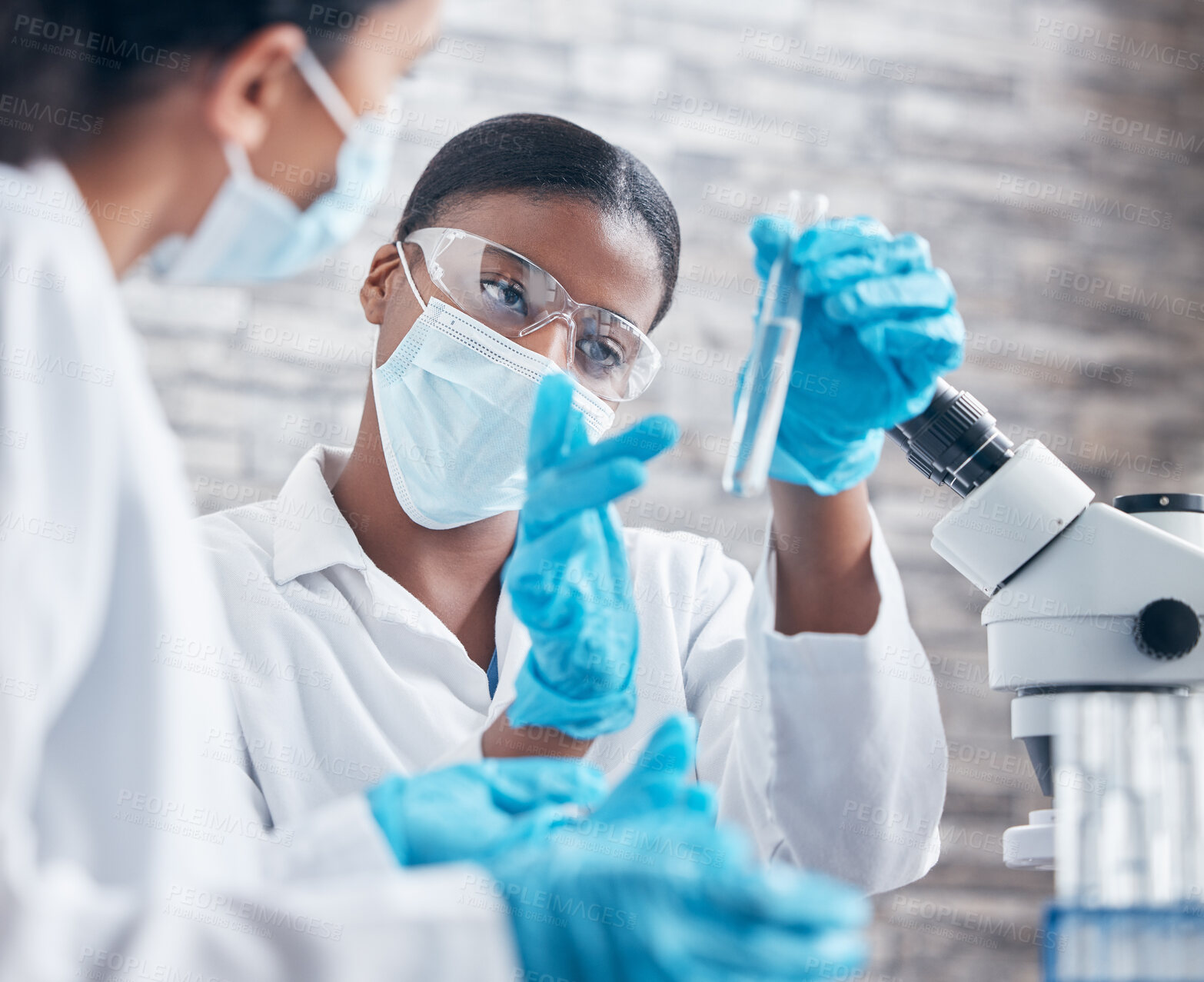 Buy stock photo Women, ppe and test tube for innovation in laboratory for research, medical care and health. Teamwork, mask and working in clinic for pharmaceutical company and investigation for vaccine or safety