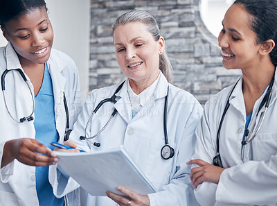 Buy stock photo Women, doctors and paperwork in hospital for results, collaboration and diversity in workplace. Teamwork, medical professionals and notes for healthcare, career and together for insurance and support