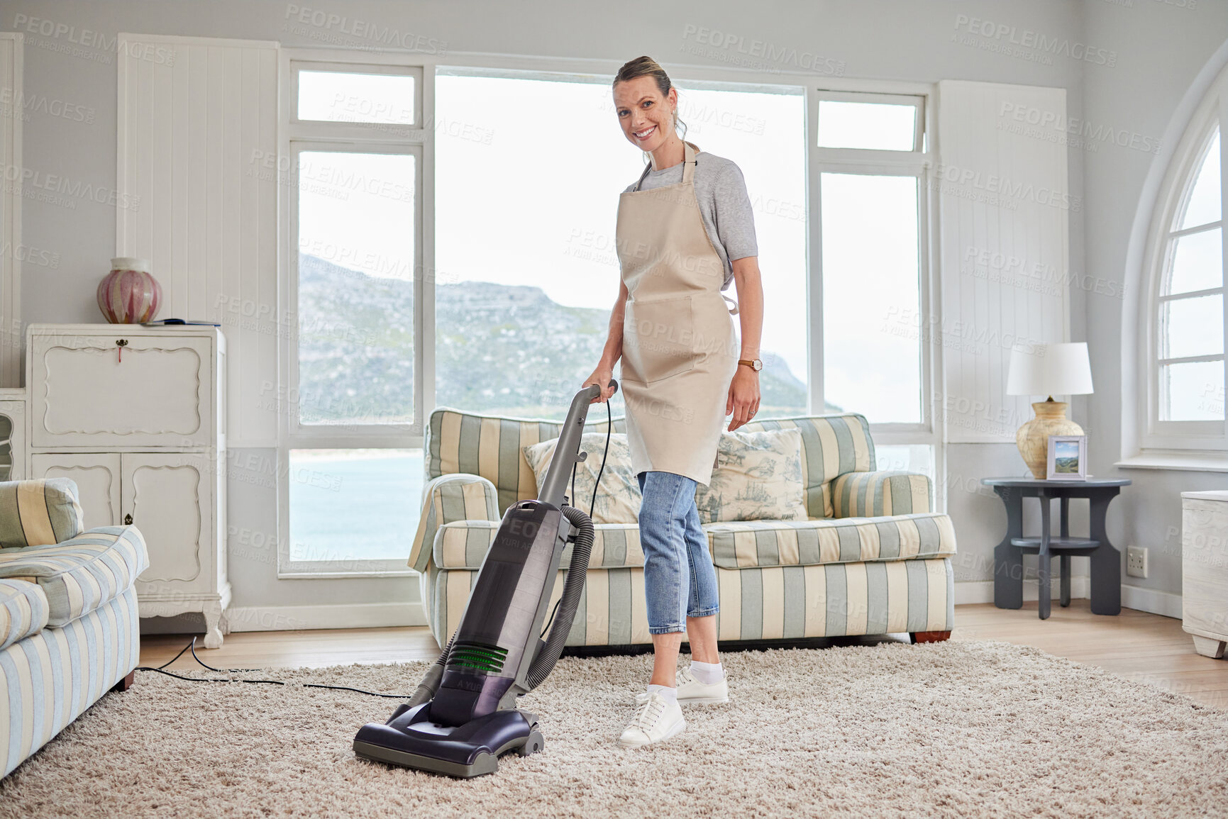 Buy stock photo Home, portrait and woman with vacuum in cleaning for hygiene, housekeeping and chores on weekend. Person, smile and carpet with electrical equipment for germs, dust and dirt removal in living room