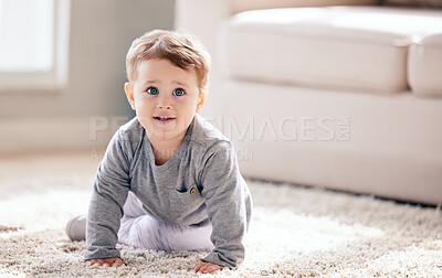 Buy stock photo Shot of an adorable little boy crawling at home