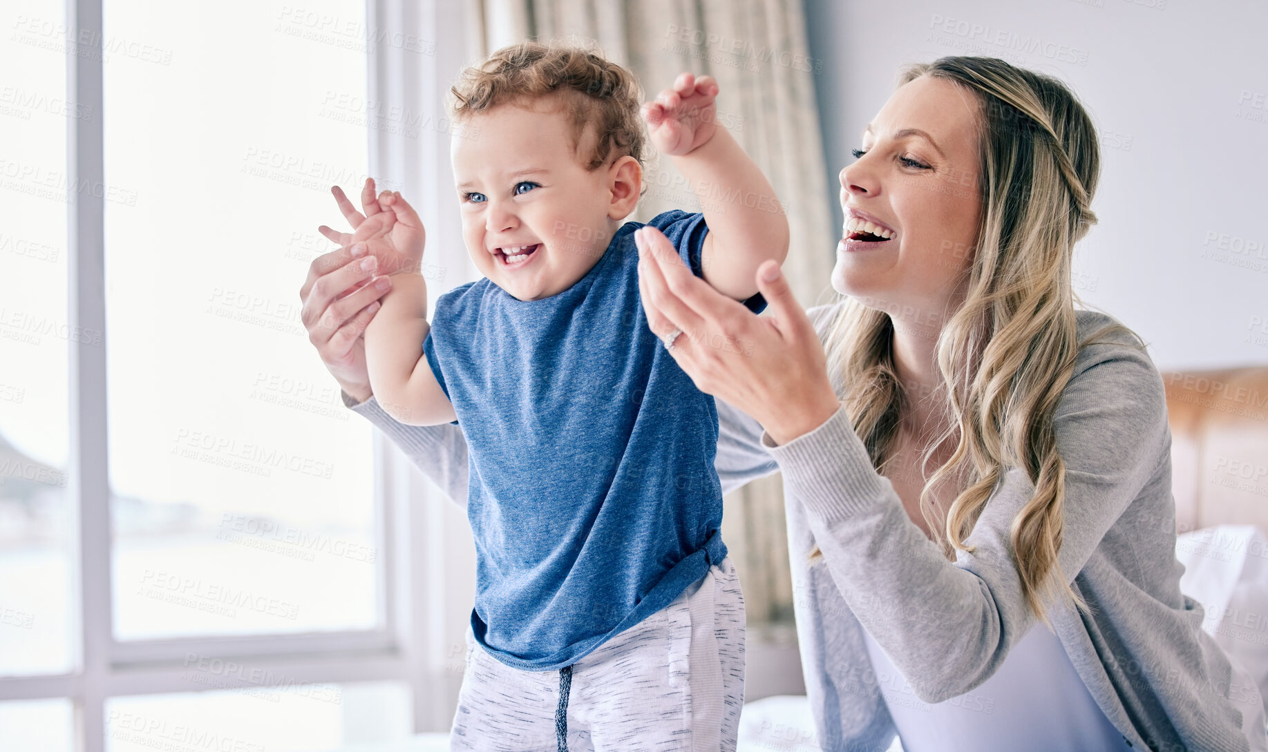 Buy stock photo Mother, baby and excited for playing in home, childcare and support or love in bedroom. Mama, son and single parent for security or bonding on bed for connection in relationship, care and trust