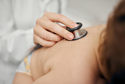 Buy stock photo Shot of a unrecognizable  pediatrician examining a baby in a clinic