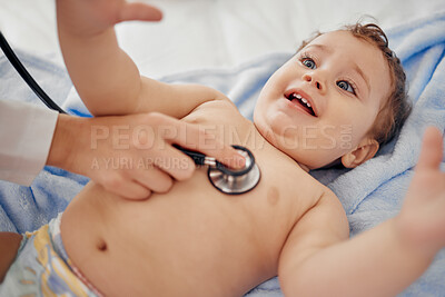Buy stock photo Shot of a paediatrician examining a baby in a clinic