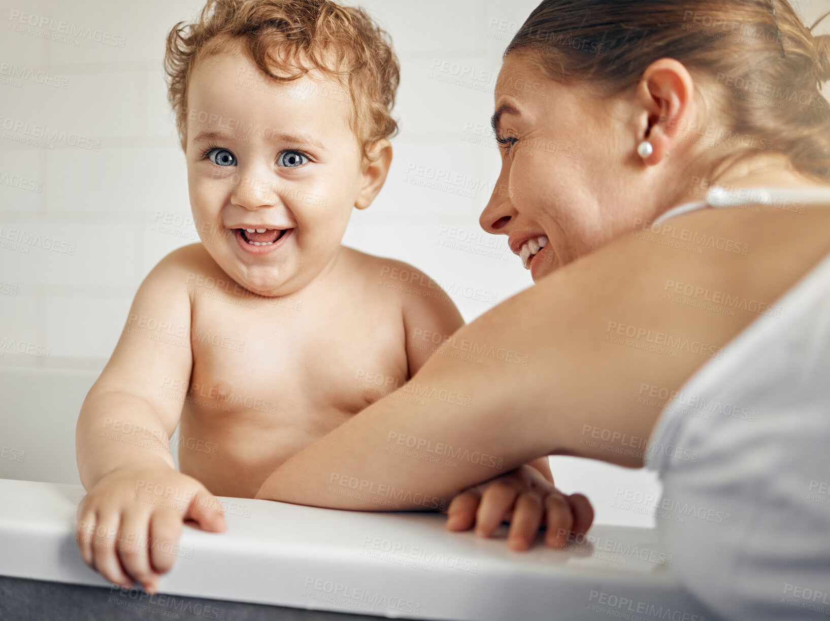 Buy stock photo Mom, baby and portrait in bathroom for bath, cleaning and hygiene with night time routine for growth or development. Toddler, home and washing in bathtub for skin care, happiness and wellness.