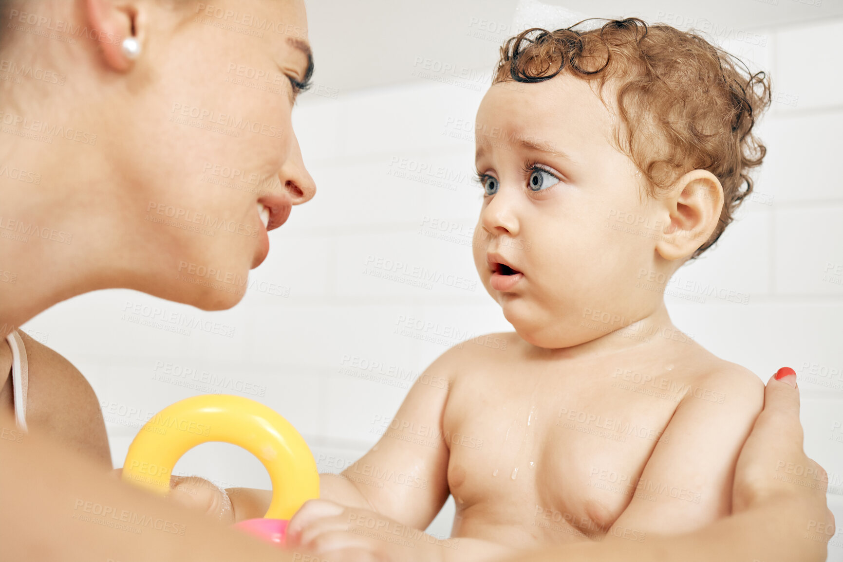 Buy stock photo Mother, boy and cleaning baby in bathroom, kid and scared of washing or water in home. Mommy, son and support for child fear and encouragement for hygiene, helping and skincare or bonding for health