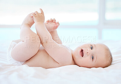 Buy stock photo Happy, baby and portrait on bed for game, relax and development or learning in home. Child, wake up and smile in nursery for motor skills and face in morning for play, wellness and healthy for growth