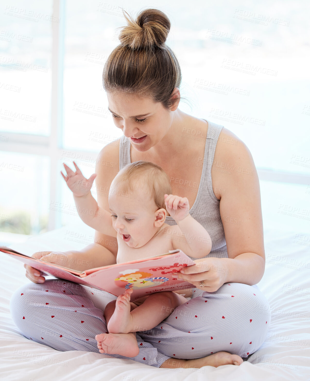 Buy stock photo Mother, baby and book for reading in bed with learning, knowledge and support for language development. Mama, young boy and excited for storytelling with fiction and child education in family home