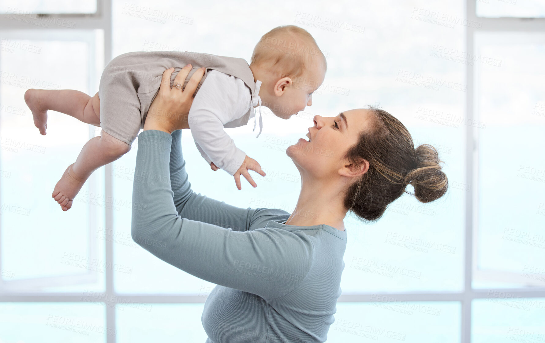 Buy stock photo Baby, mother and play in family home together for care, love and support or happiness in morning. Mom, smile and woman with kid in apartment for childhood, development and laugh or excited for game