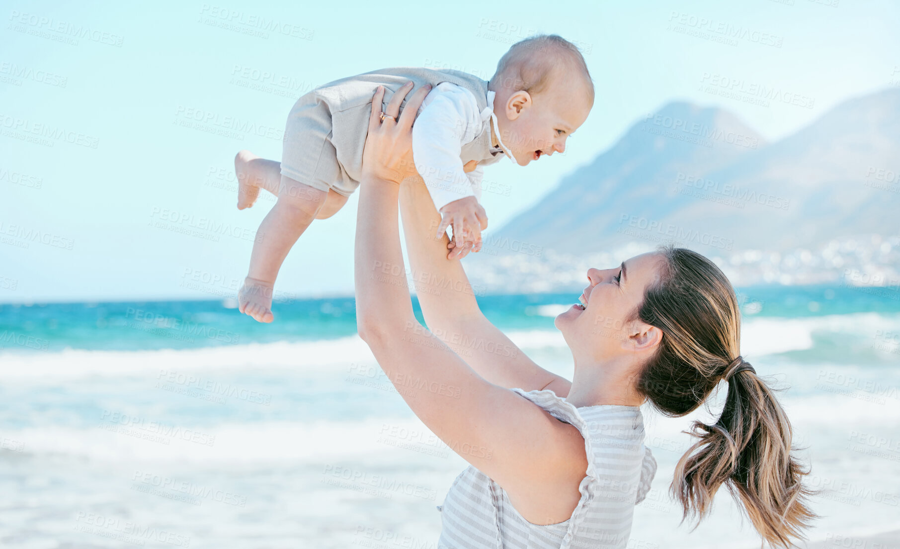 Buy stock photo Kid, mama and airplane game on beach together for care, love and support or happiness in nature. Family, smile and woman and baby outdoor for childhood, development and adventure or sunshine 