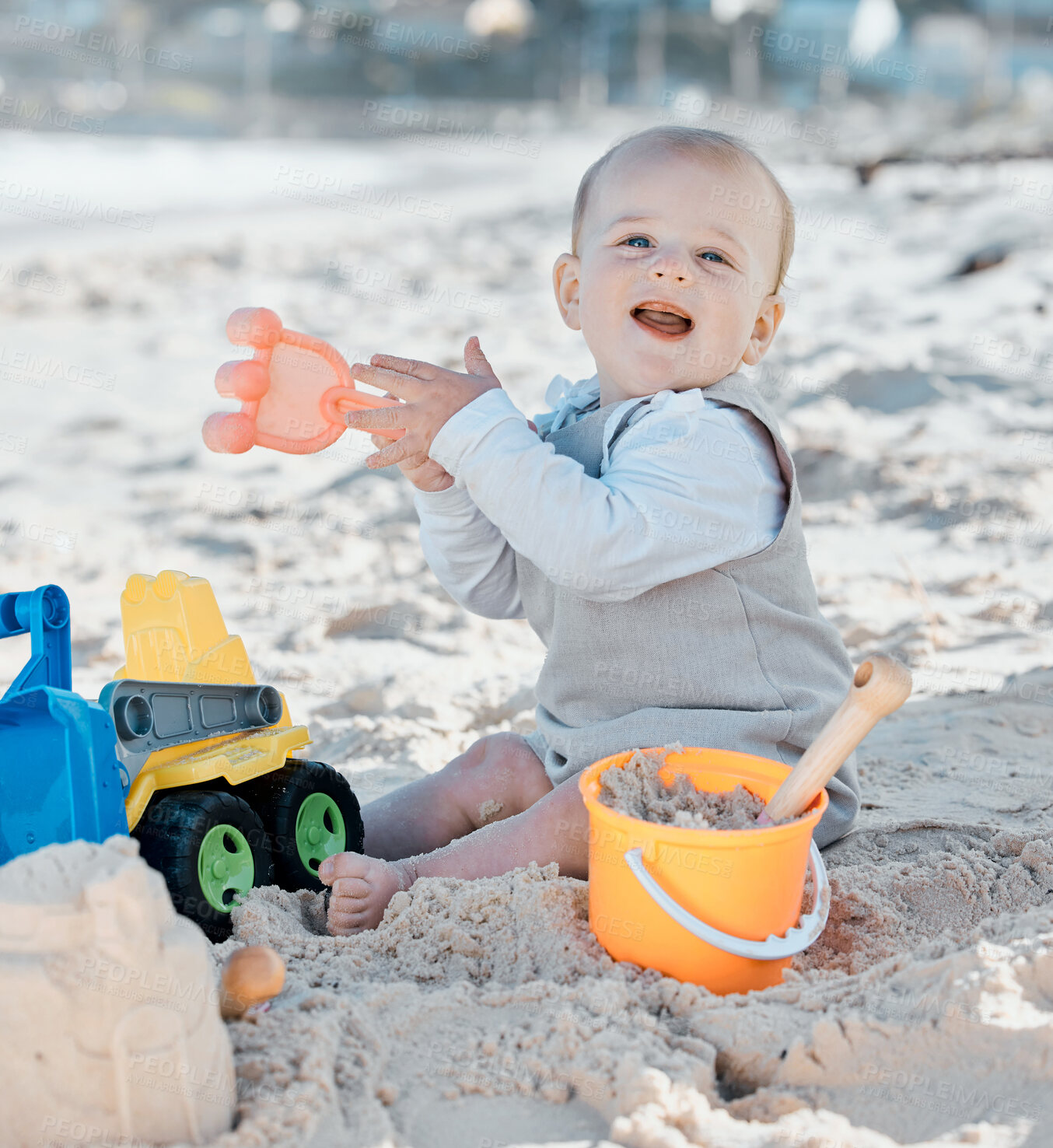 Buy stock photo Portrait, baby and playing with sand on beach for vacation, development and motor skills in nature. Young boy, truck toy and sea adventure for summer trip with travel and building sandcastle in Miami