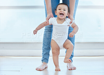 Buy stock photo Happy, baby and person walking in home for childhood, development and support for growth. First steps, legs and kid with mother in lounge for learning, teaching and together for exercise and balance 