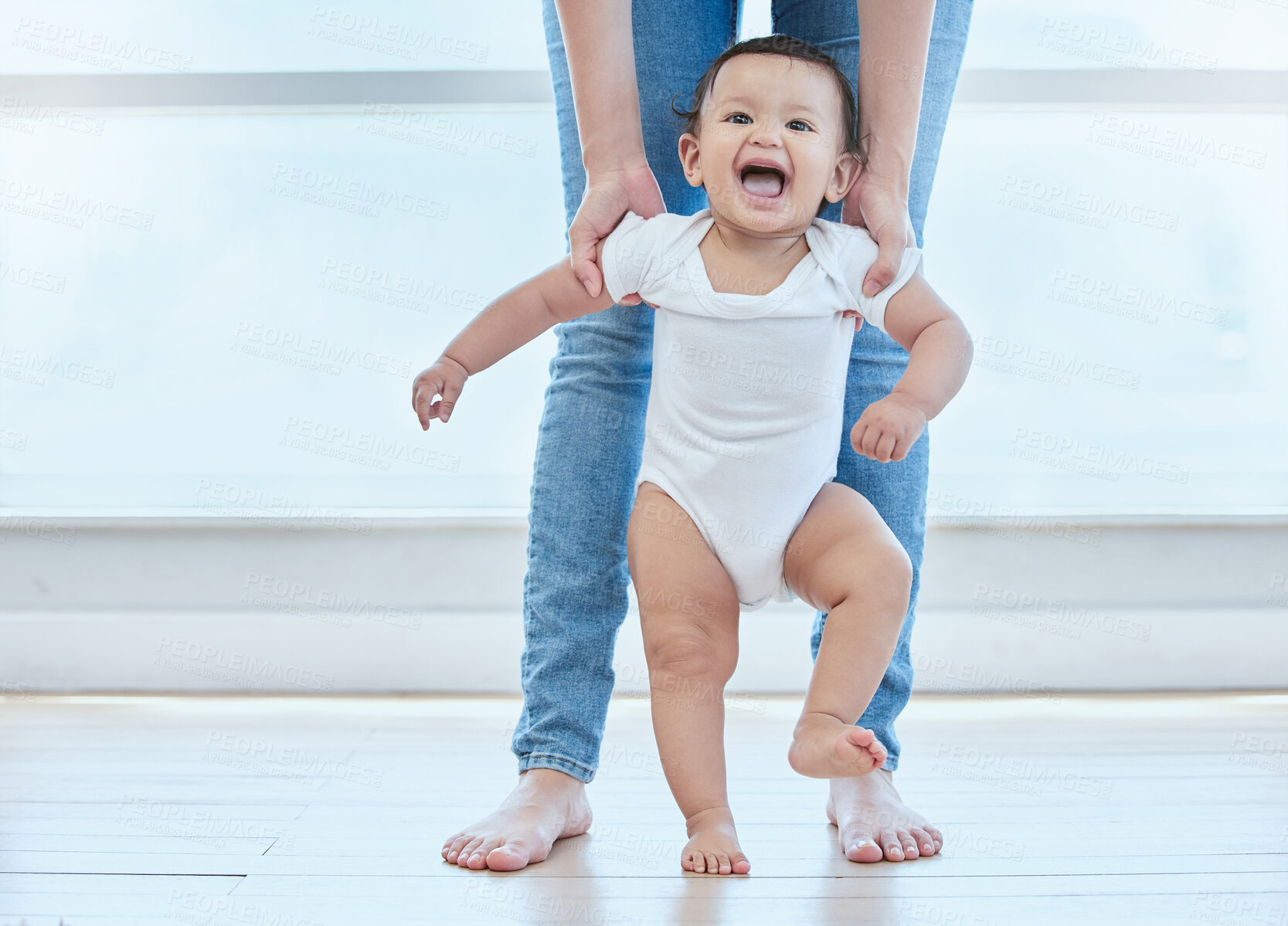 Buy stock photo Happy, baby and person walking in home for childhood, development and support for growth. First steps, legs and kid with mother in lounge for learning, teaching and together for exercise and balance 