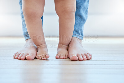 Buy stock photo Baby, walking and feet in lounge with person for growth, development and support for childhood. First steps, legs and together in home for learning, teaching and mother for exercise or balance